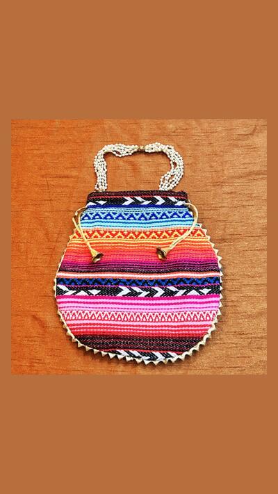 Embroidered pouch with a beaded handle