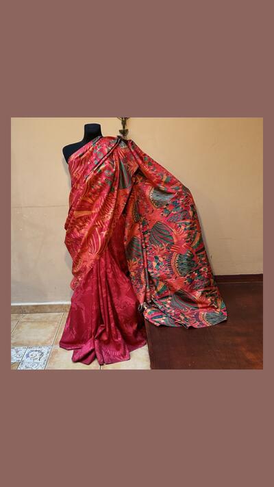 Red silk sari with a green pattern on the headpiece