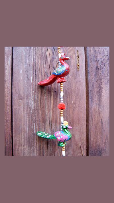 Hanging peacocks