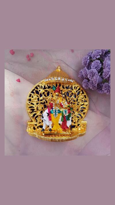 Radha Krishna with a calf – a gilded murti