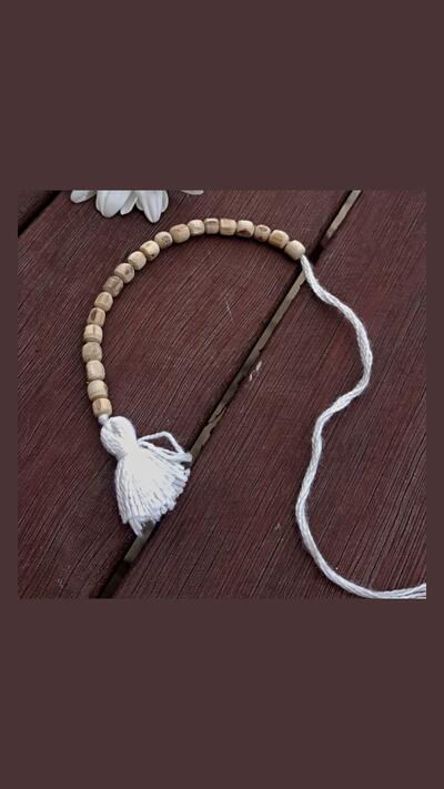 A rosary counter for a bag of Tulsí beads