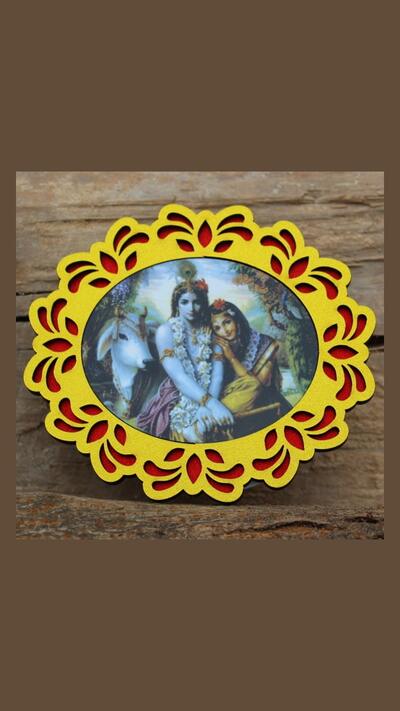 Wooden sticker featuring Krishna and Radha with a little cow