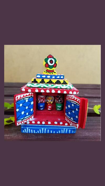A painted wooden Jagannath altar