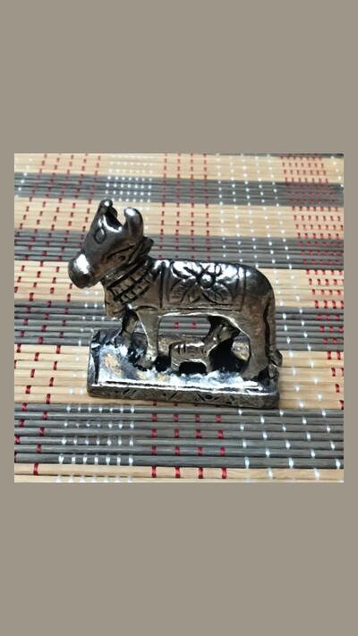 A cow with a calf, metal