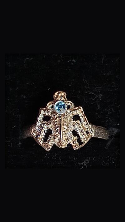 Oriental metal ring with a coloured gemstone