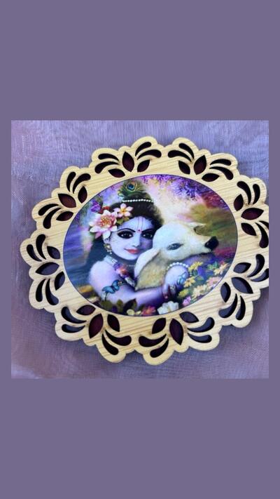 Wooden sticker of Krishna with a little cow