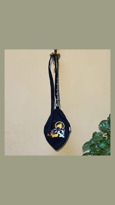 Dark blue Krishna japa bag with a little cow