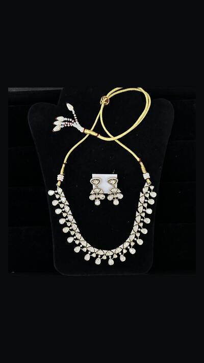 Vrinda Creation Necklace with clear stones and earrings