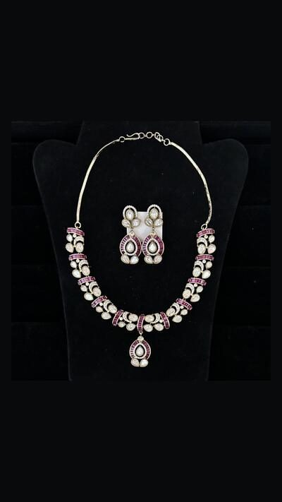 Vrinda Creation Necklace with clear and red stones and earrings