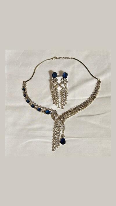 Vrinda Creation Necklace with rhinestones and blue stones, earrings