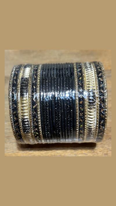 Set of 24 black and gold bracelets with red highlights