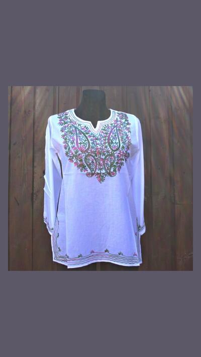 Women’s white kurta with colourful embroidery, long sleeves