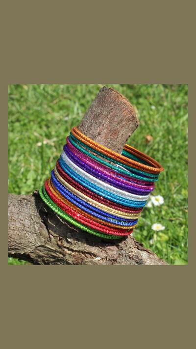 Set of 24 rainbow-coloured bracelets